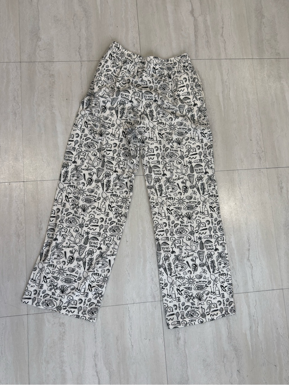 White pants with a black print